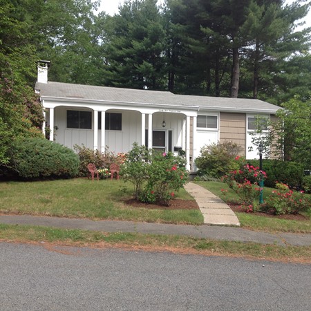 24 Tanglewood Road Needham, MA 02494 - Photo 1 of 8 a front view of a house with a garden