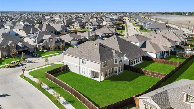 an aerial view of a house with a garden