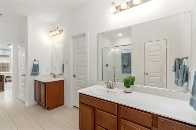 a bathroom with a sink and mirror