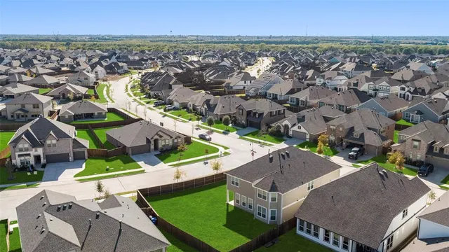 an aerial view of a house with a garden