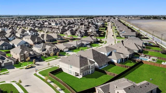 an aerial view of a house with a garden