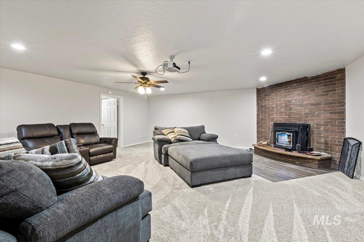 11545 Kuna Road Kuna, ID 83634 - Photo 32 of 50 Carpeted living room featuring a ceiling fan and recessed lighting