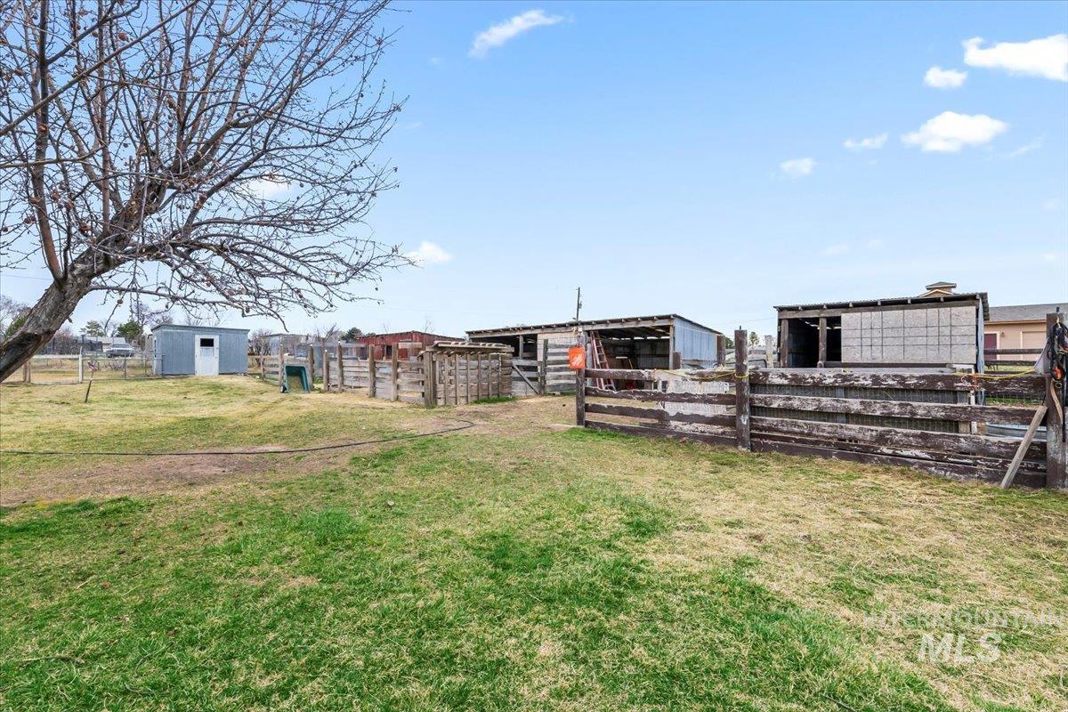 11545 Kuna Road Kuna, ID 83634 - Photo 42 of 50 View of grassy yard featuring an outbuilding and an exterior structure