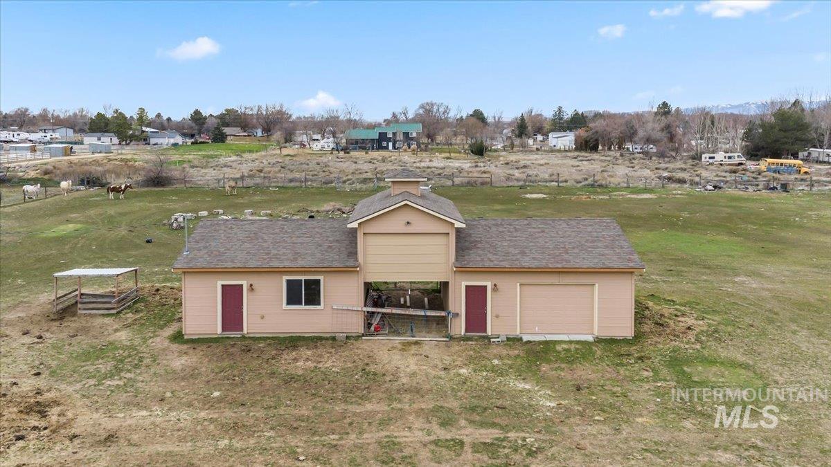 11545 Kuna Road Kuna, ID 83634 - Photo 44 of 50 Outbuilding with two separate areas, one with rolling garage door. Covered storage between with loft area above
