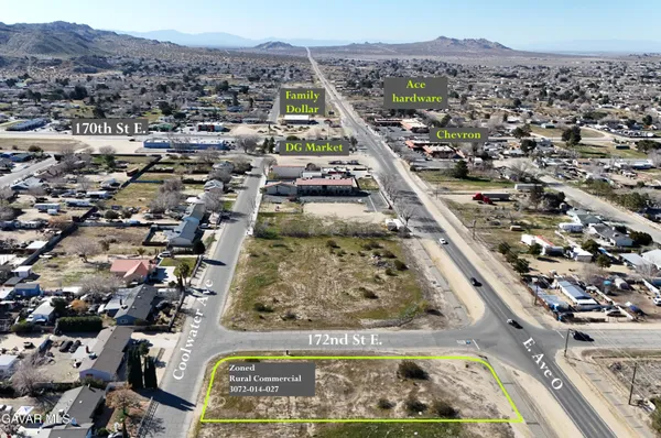 an aerial view of a residential houses and city street