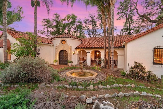 Sunset views envelop this majestic Spanish Revival Masterpiece.