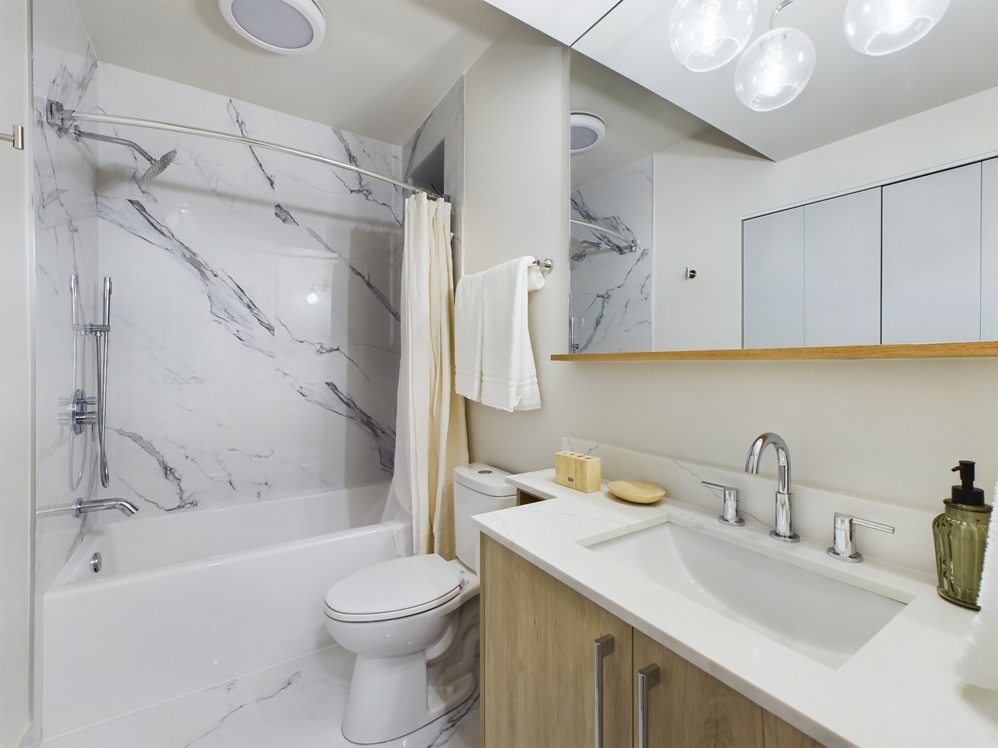 2437 West Walton Street, Unit 2F Chicago, IL 60622 - Photo 11 of 21 a bathroom with a sink toilet and shower