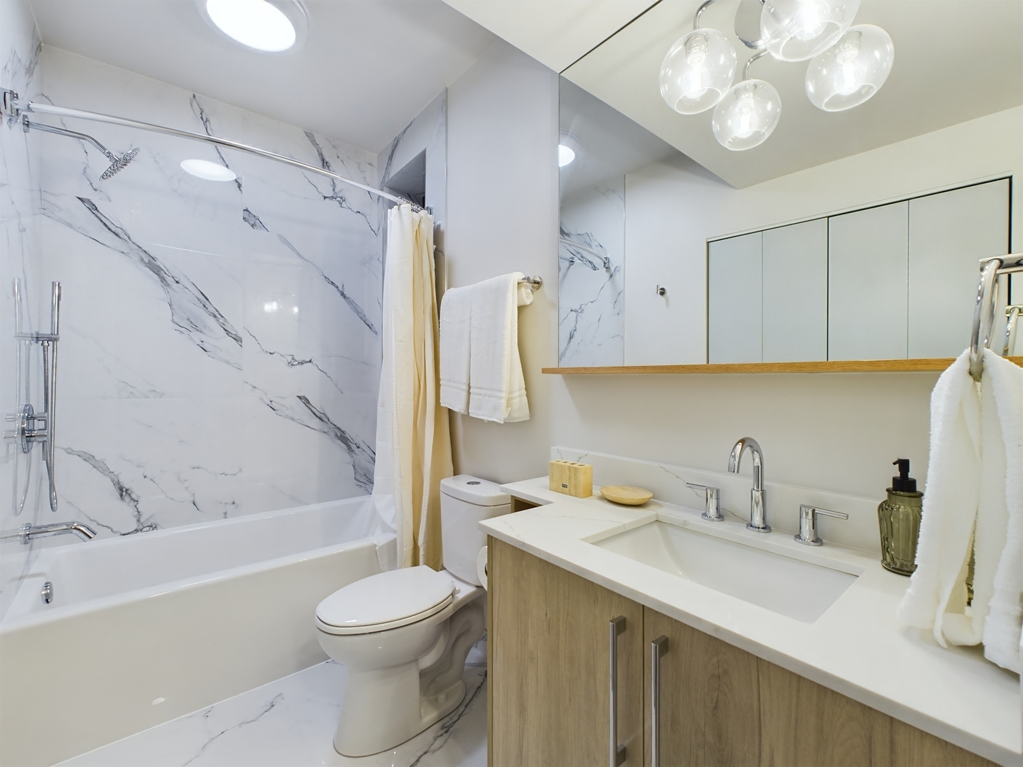 2437 West Walton Street, Unit 2F Chicago, IL 60622 - Photo 13 of 21 a bathroom with a sink a toilet and shower