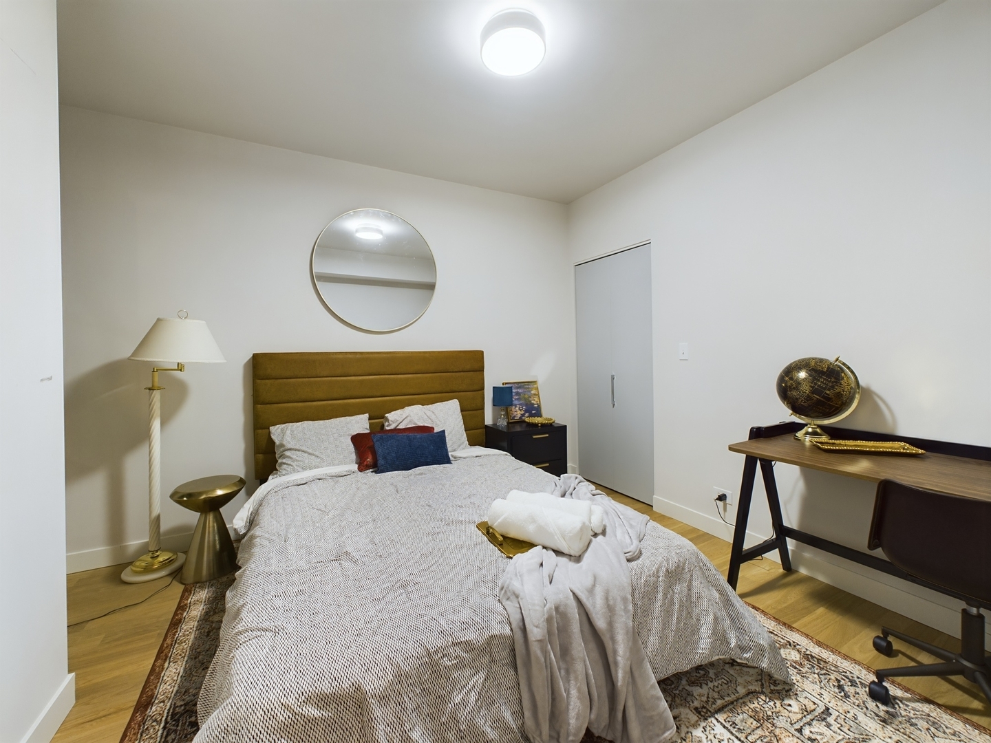 2437 West Walton Street, Unit 2F Chicago, IL 60622 - Photo 19 of 21 a bedroom with a bed and a chandelier