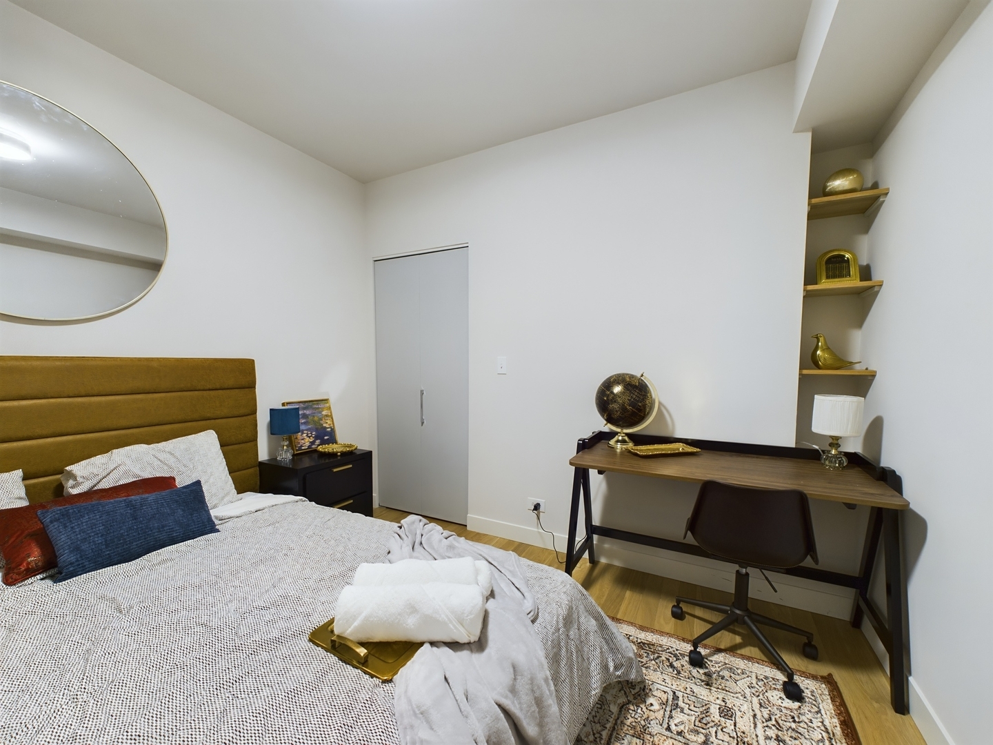 2437 West Walton Street, Unit 2F Chicago, IL 60622 - Photo 20 of 21 a bedroom with a bed and cabinets