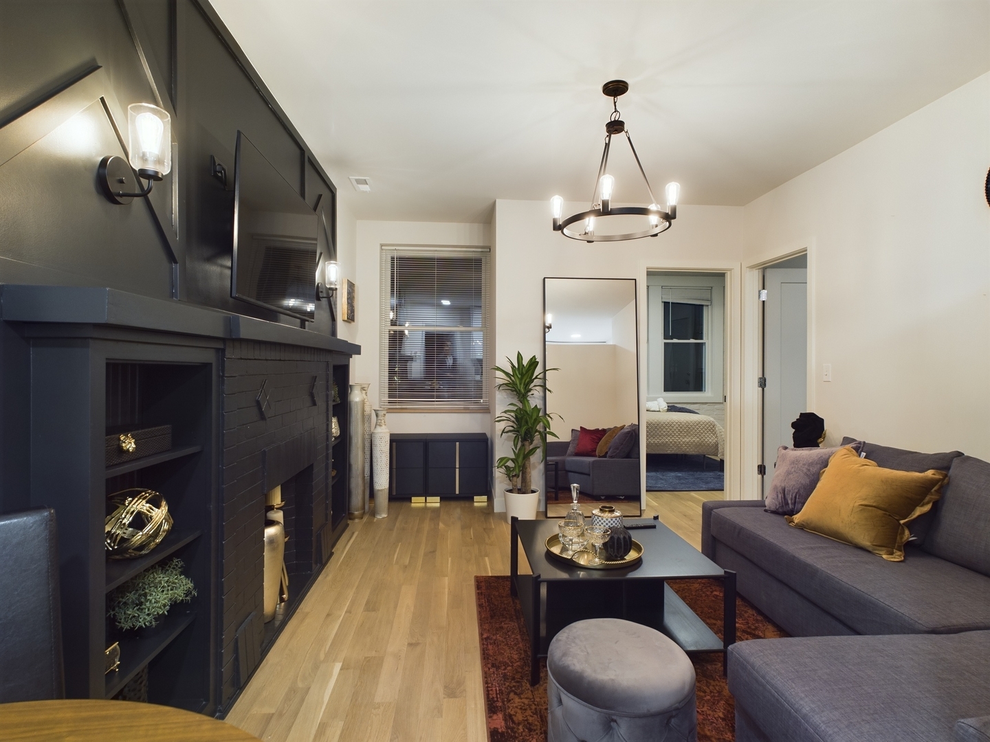 2437 West Walton Street, Unit 2F Chicago, IL 60622 - Photo 2 of 21 a living room with furniture a dining table and a fireplace