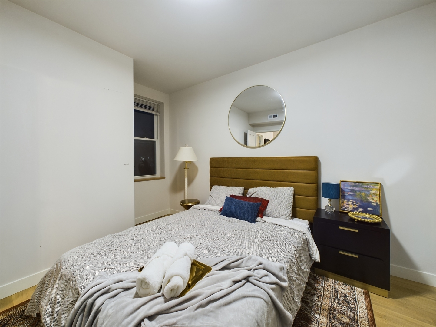 2437 West Walton Street, Unit 2F Chicago, IL 60622 - Photo 21 of 21 a bedroom with a bed and wooden floor