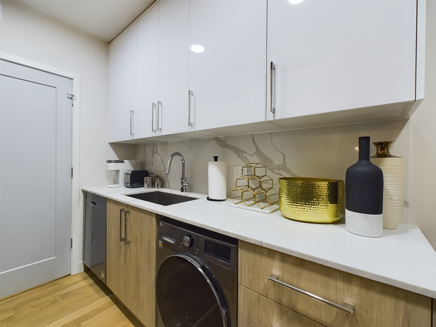 2437 West Walton Street, Unit 2F Chicago, IL 60622 - Photo 9 of 21 a kitchen with a sink a stove and cabinets