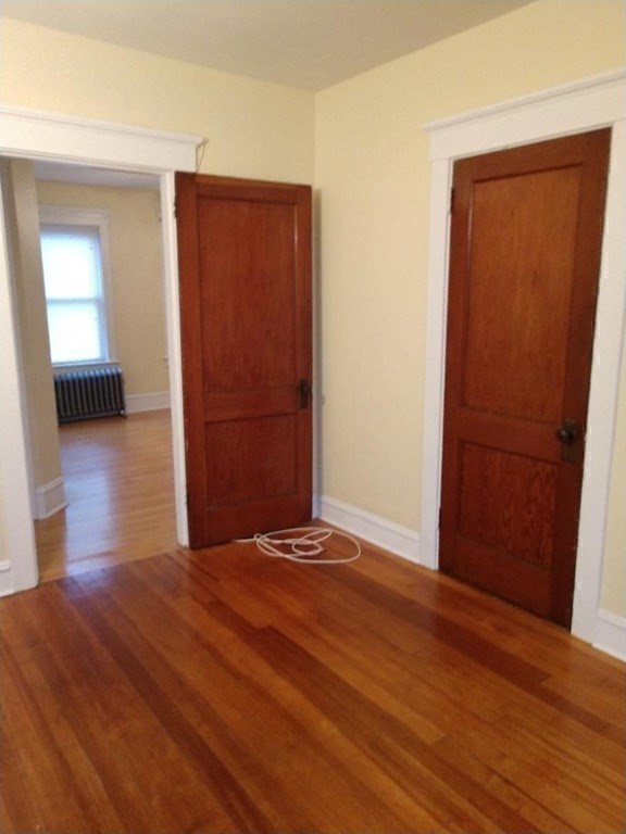 362 Pearce Street, Unit 2 Fall River, MA 02720 - Photo 16 of 24 an empty room with wooden floor and closet