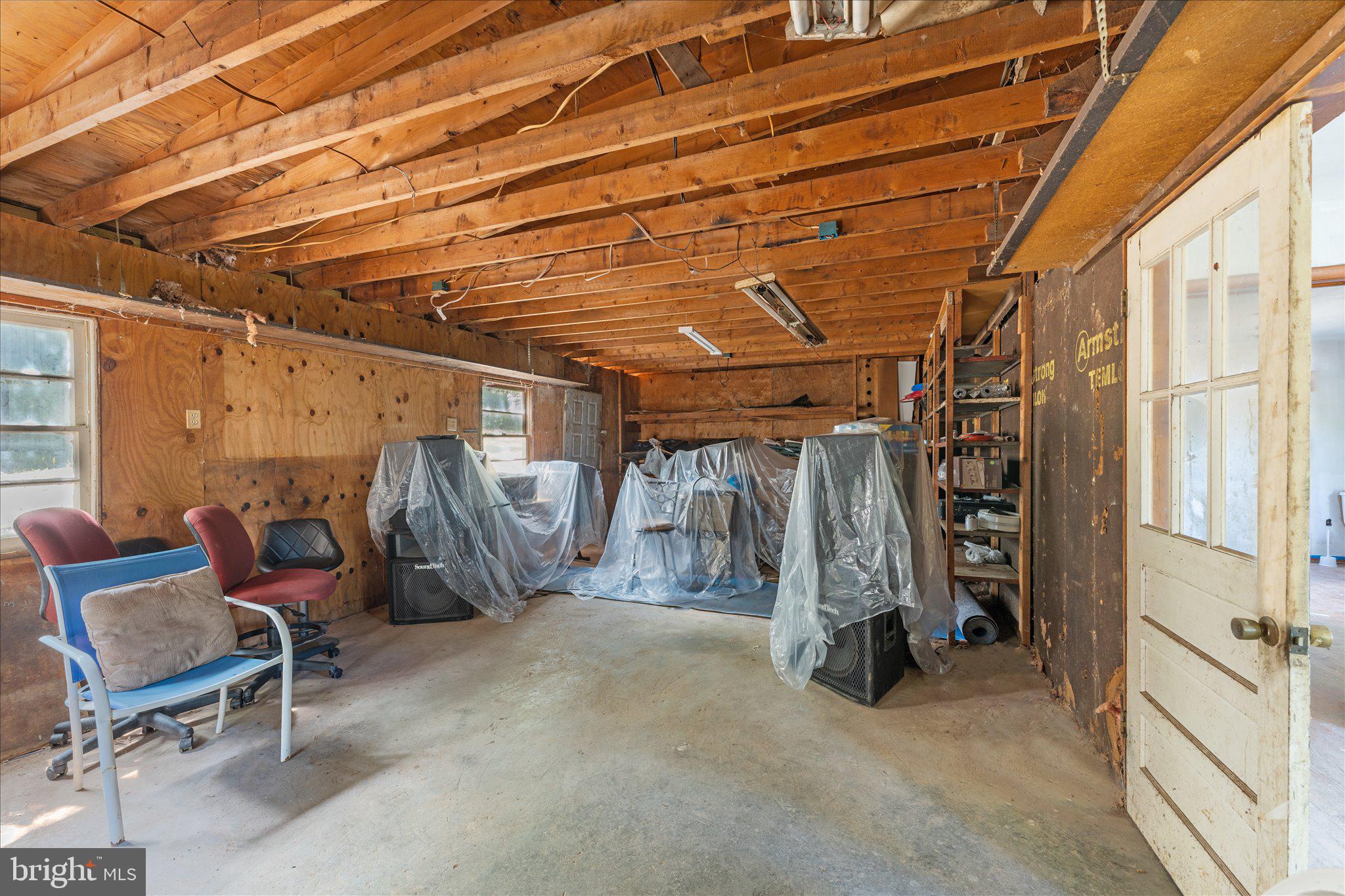 202 Cedar Grove Road Winchester, VA 22603 - Photo 9 of 21 Spacious garage with rustic charm.