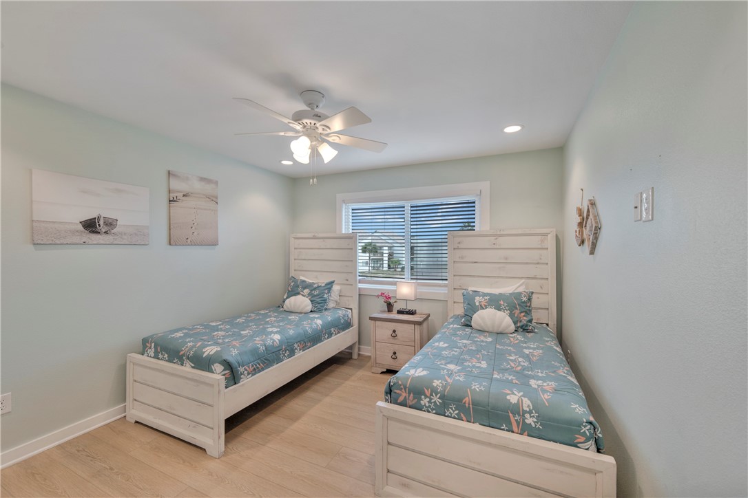 230 Cut-Off Road, Unit 205 Port Aransas, TX 78373 - Photo 14 of 37 a living room with furniture and a chandelier