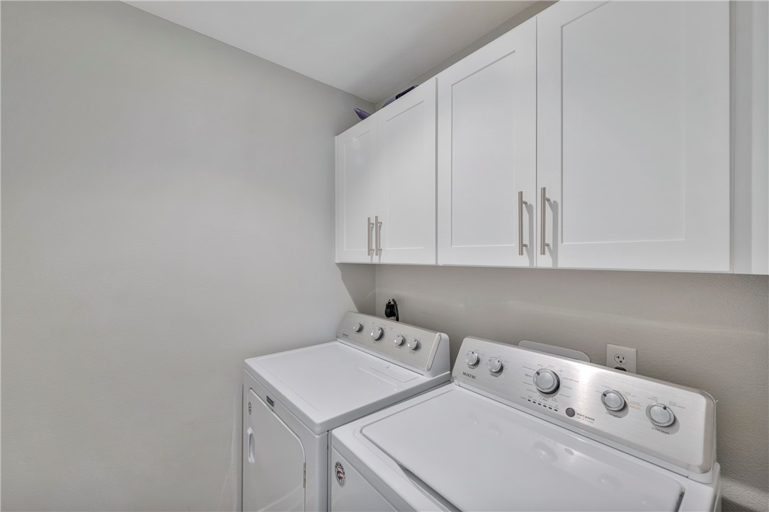 230 Cut-Off Road, Unit 205 Port Aransas, TX 78373 - Photo 19 of 37 a utility room with dryer and washer