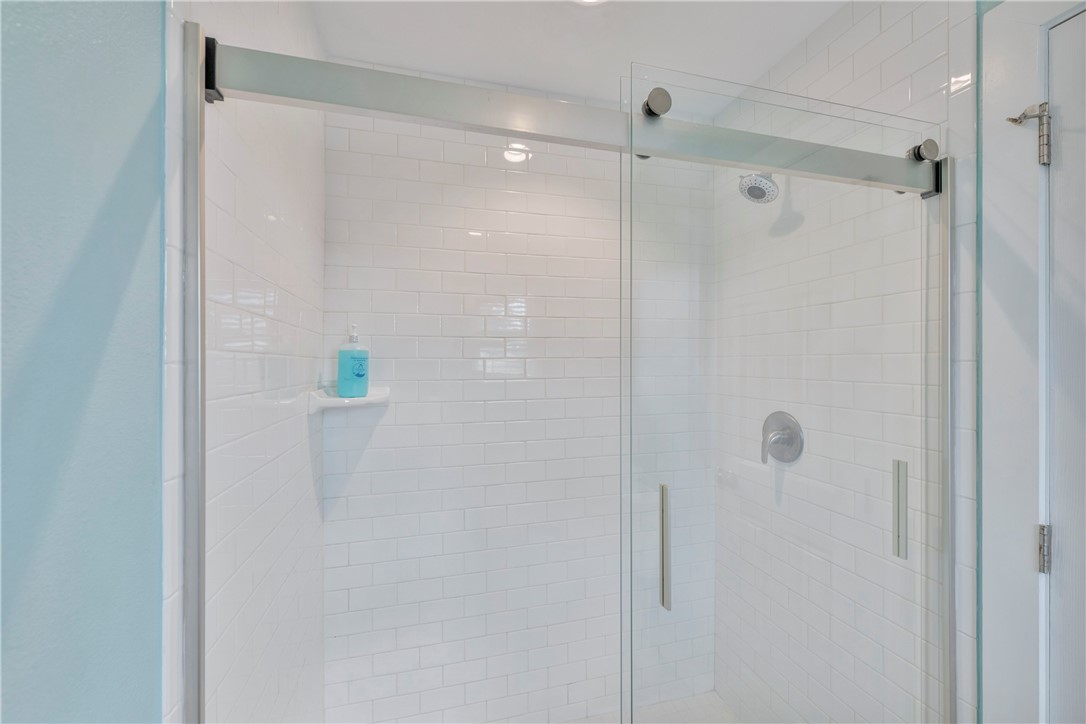 230 Cut-Off Road, Unit 205 Port Aransas, TX 78373 - Photo 24 of 37 a bathroom with a shower