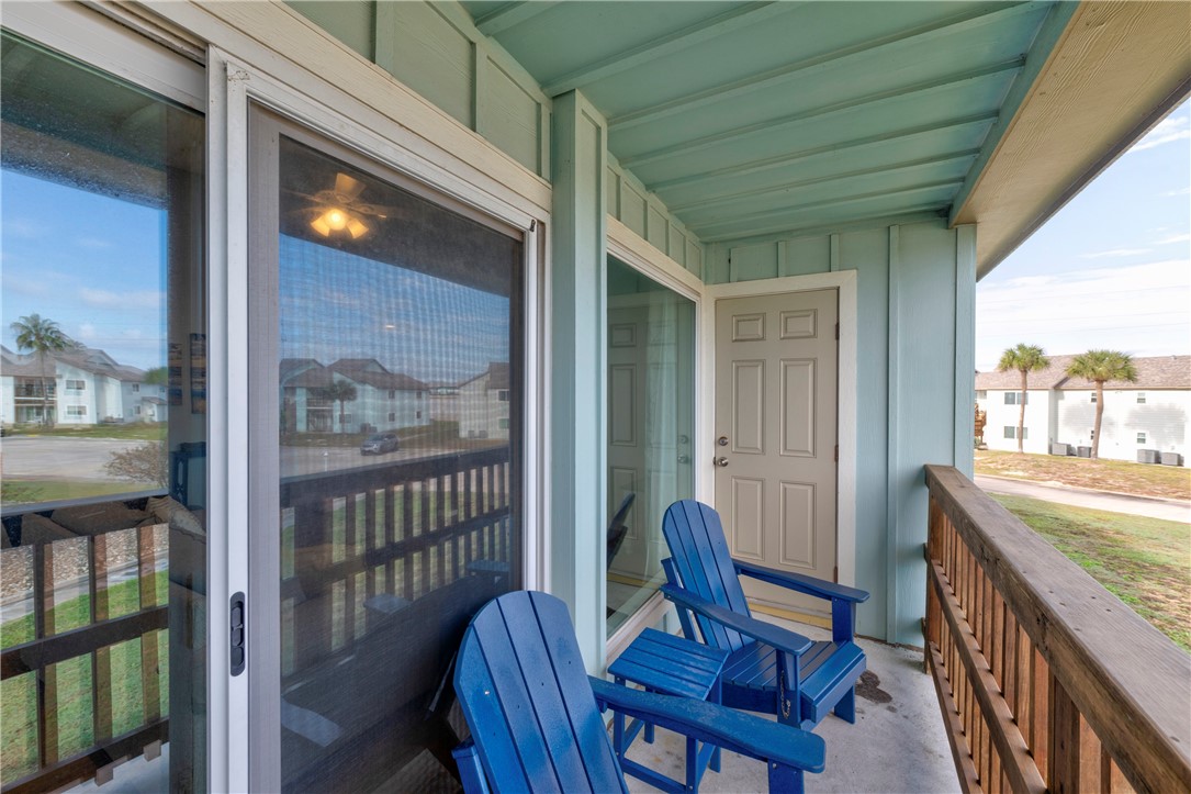 230 Cut-Off Road, Unit 205 Port Aransas, TX 78373 - Photo 25 of 37 a view of a balcony with furniture