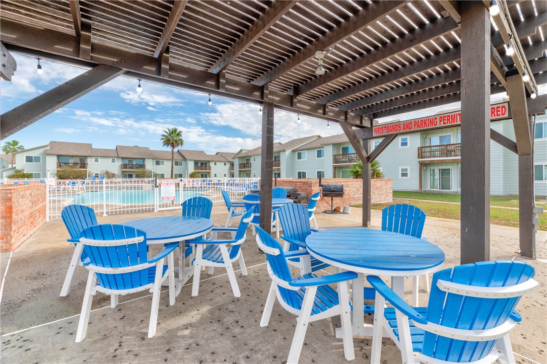 230 Cut-Off Road, Unit 205 Port Aransas, TX 78373 - Photo 29 of 37 a view of a dining room with furniture window and outside view