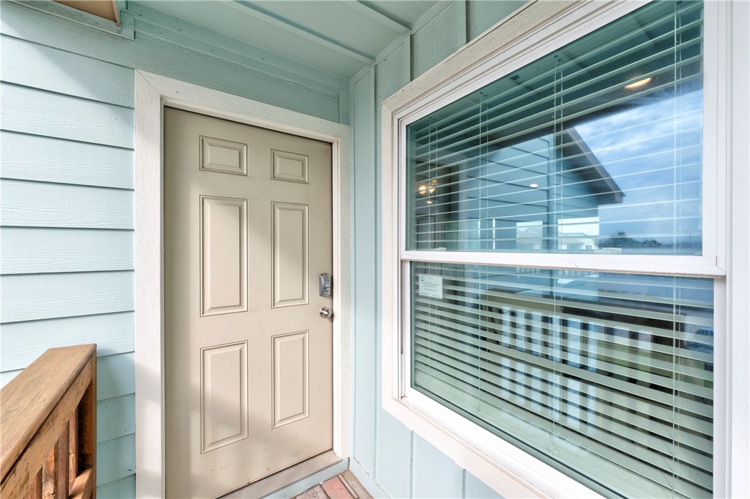 230 Cut-Off Road, Unit 205 Port Aransas, TX 78373 - Photo 3 of 37 a view of a door and a window
