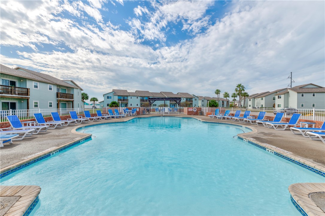 230 Cut-Off Road, Unit 205 Port Aransas, TX 78373 - Photo 32 of 37 a city view with boat and trees