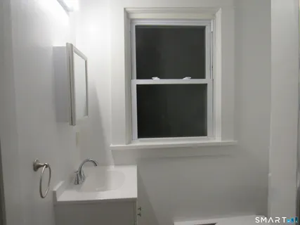 a bathroom with a sink and mirror