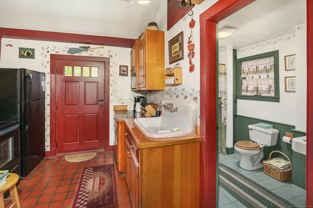 a bathroom with a toilet a sink and a shower
