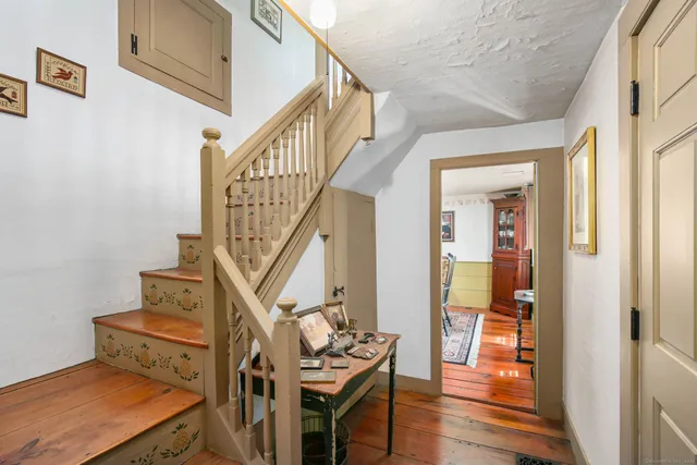 a view of hallway with wooden floor