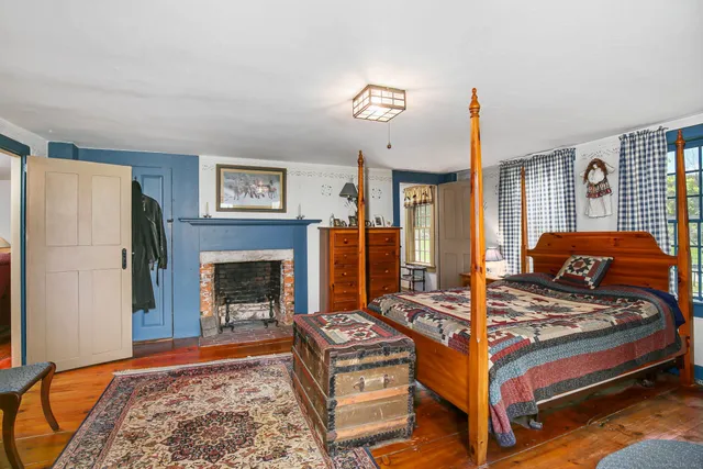 a bedroom with furniture and a window