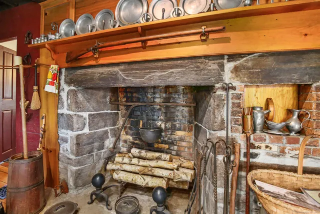 a living room with furniture a flat screen tv and a window