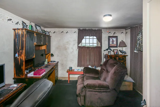 a view of front door with outdoor seating