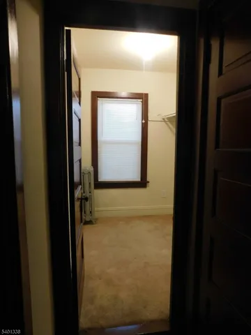 a view of front door with wooden floor