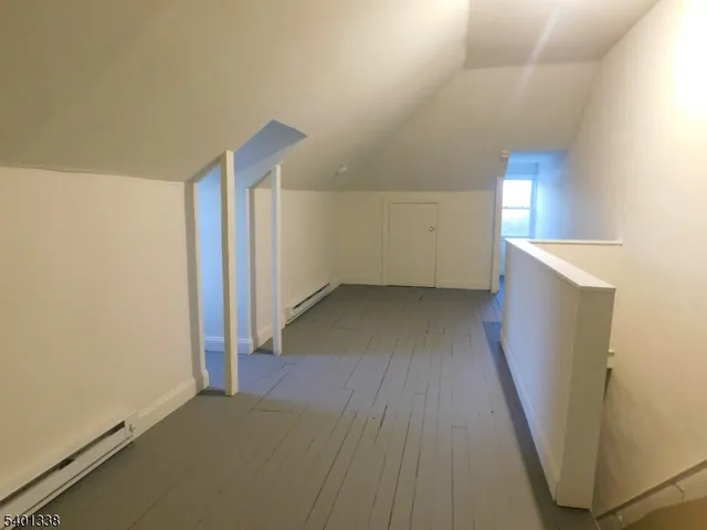 a view of water heater room with a kitchen