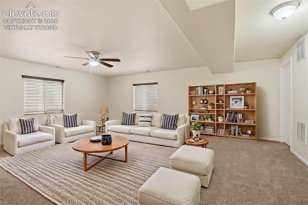7806 Dutch Loop Colorado Springs, CO 80925 - Photo 24 of 41 a living room with furniture and white walls