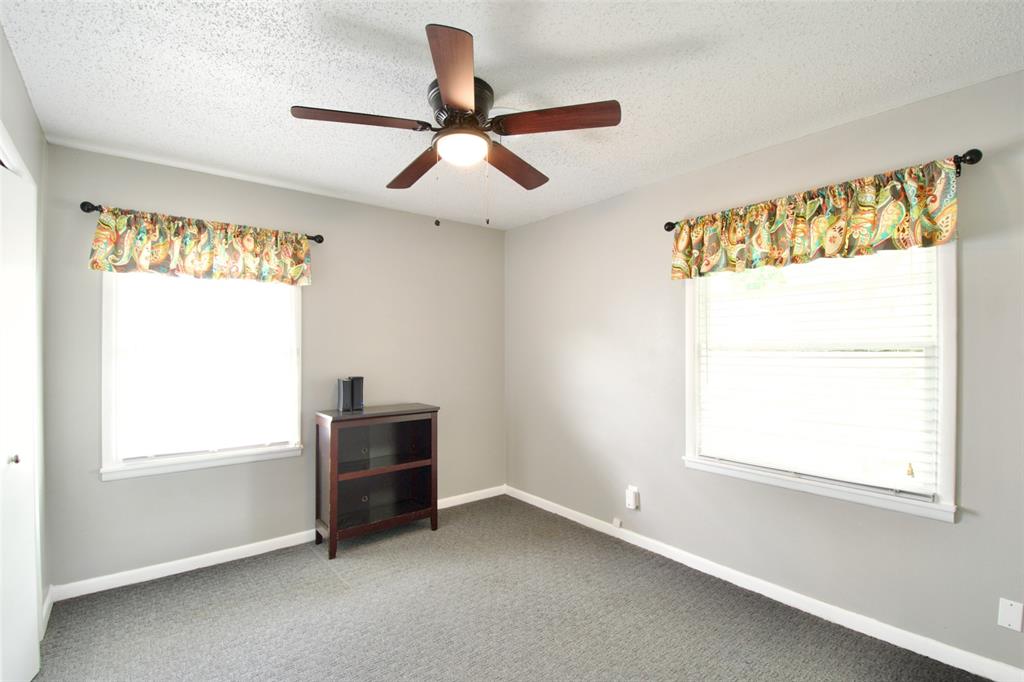 1307 North 65th Street Waco, TX 76710 - Photo 21 of 35 a view of a livingroom with a ceiling fan and a window