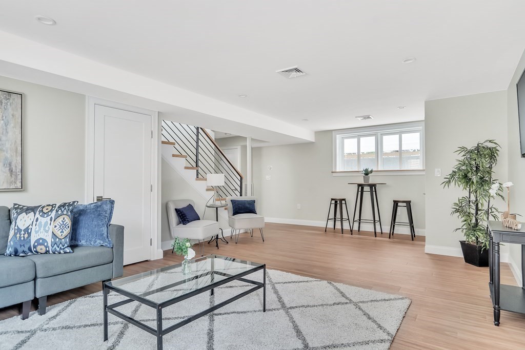 25 Quincy Street, Unit R Somerville, MA 02143 - Photo 15 of 17 a living room with furniture and a table
