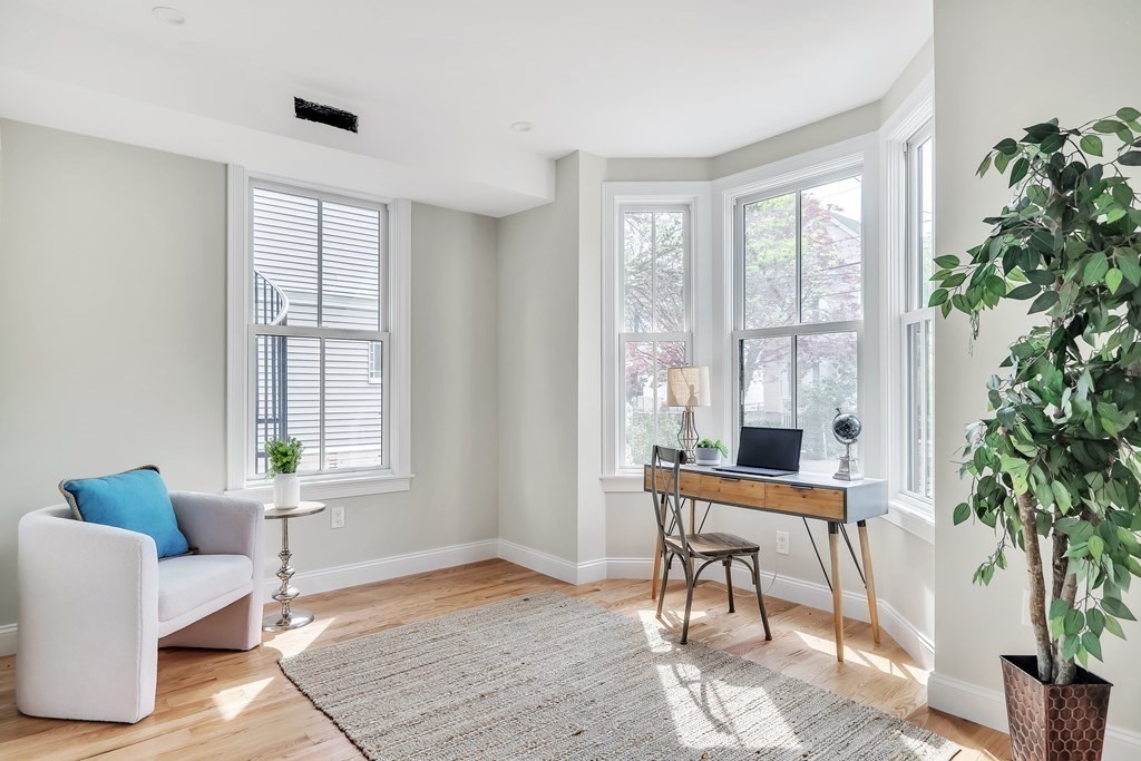 25 Quincy Street, Unit R Somerville, MA 02143 - Photo 8 of 17 a workspace with furniture and a potted plant