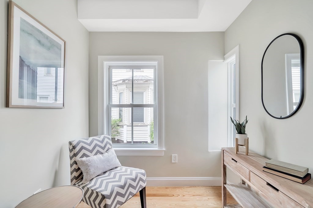 25 Quincy Street, Unit R Somerville, MA 02143 - Photo 10 of 17 a living room with furniture and a window