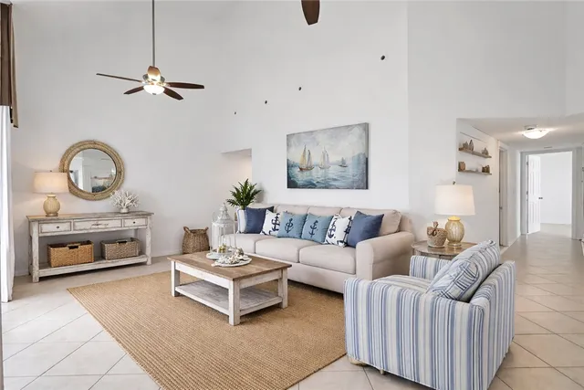 a living room with furniture and a wall clock