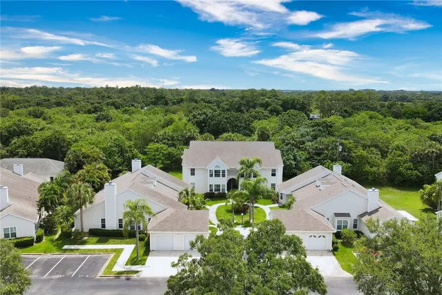 an aerial view of a house with a garden