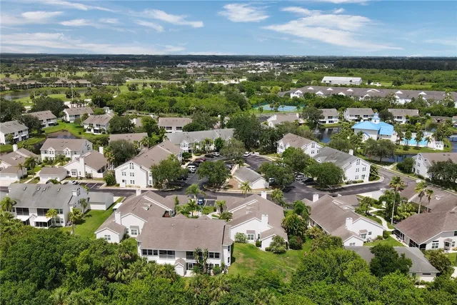 a view of a house with yard and green space