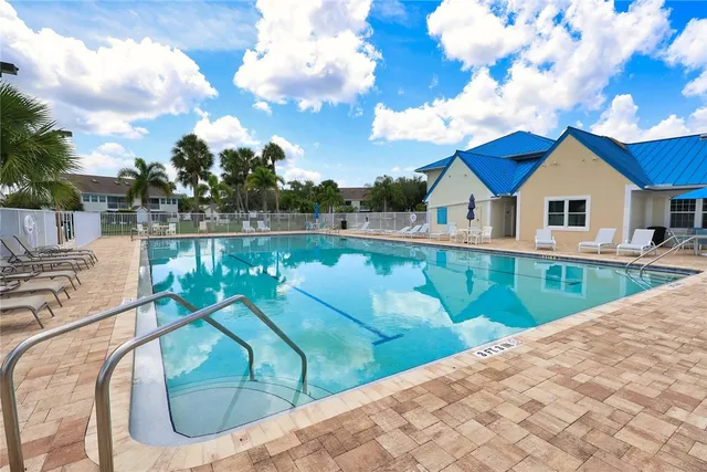 a large kitchen with stainless steel appliances kitchen island granite countertop a large center island attached withe living room