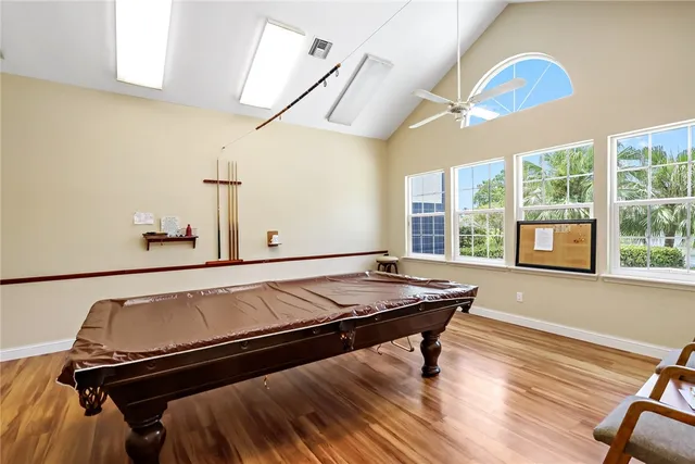 an aerial view of a house with a yard basket ball court and outdoor seating