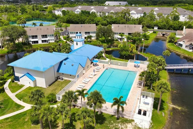 an aerial view of a house with a swimming pool