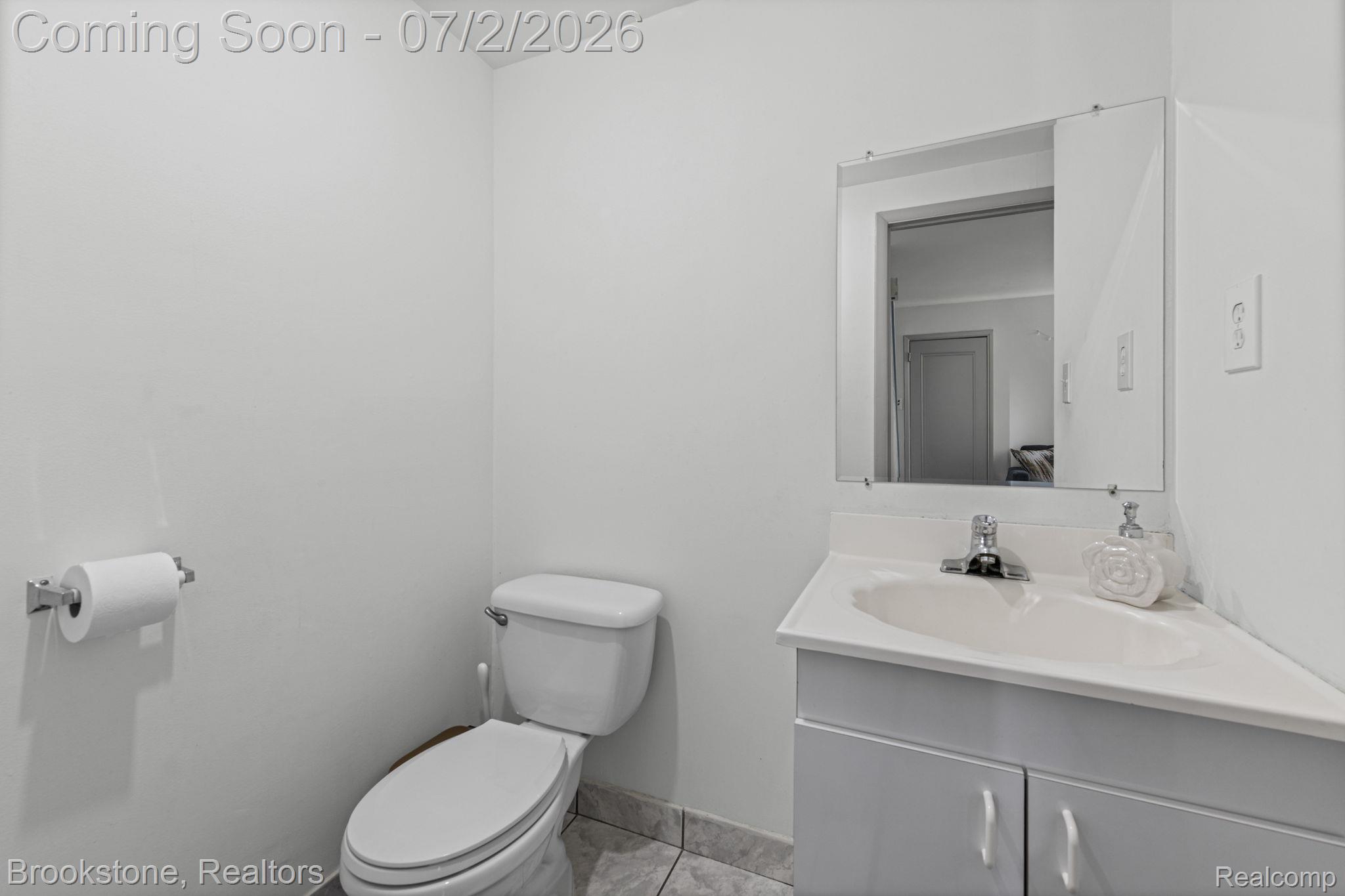 1925 Nicholas Court Warren, MI 48092 - Photo 8 of 26 Compact bathroom with white walls and a corner vanity