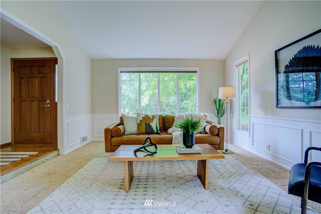 18322 Bellflower Road Bothell, WA 98012 - Photo 11 of 34 a living room with furniture and a window