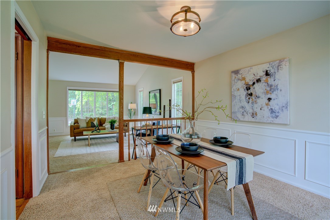18322 Bellflower Road Bothell, WA 98012 - Photo 13 of 34 a living room with furniture and a large window