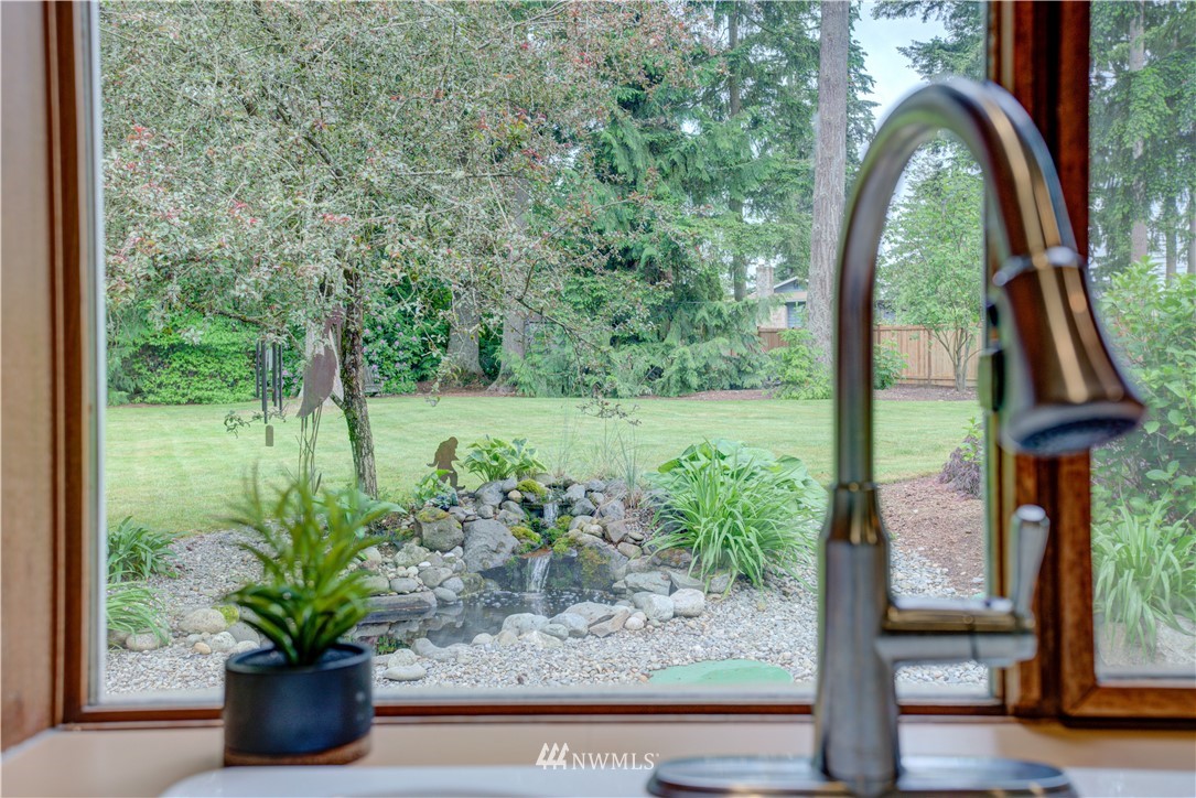 18322 Bellflower Road Bothell, WA 98012 - Photo 16 of 34 a view of a garden with a potted plant