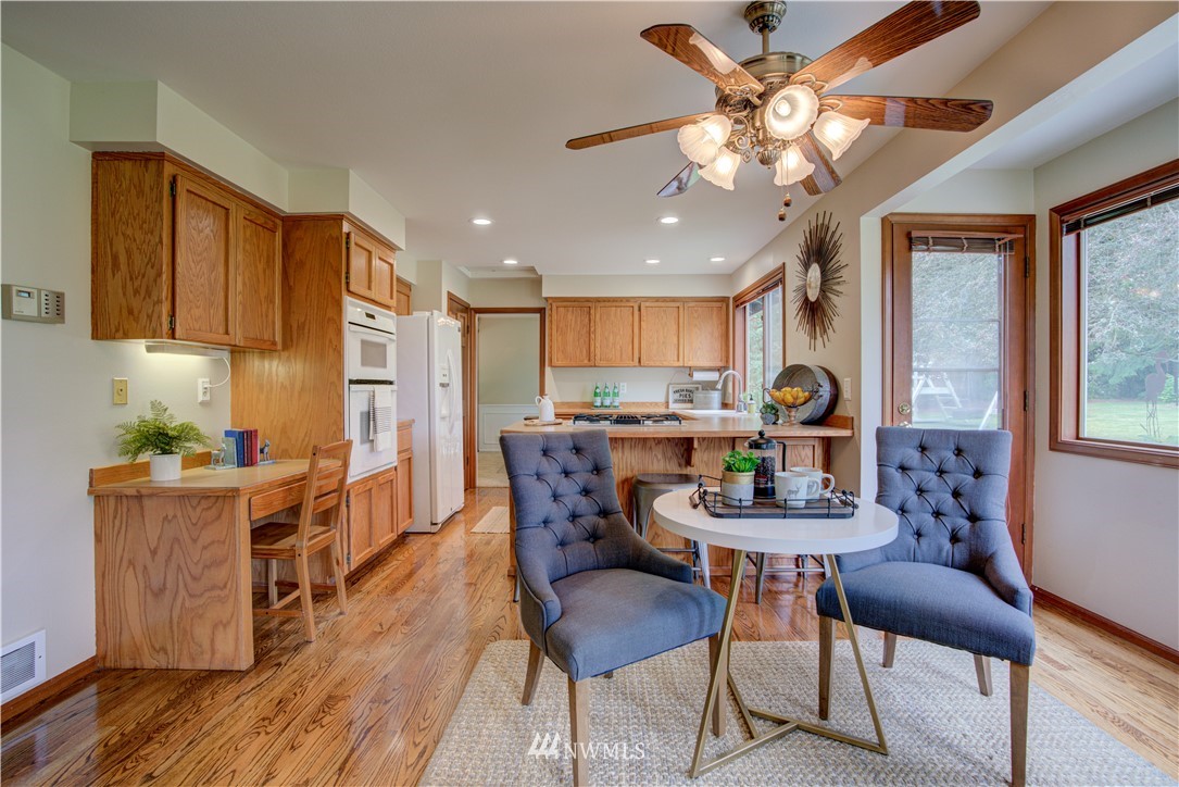 18322 Bellflower Road Bothell, WA 98012 - Photo 17 of 34 a dining room with furniture and window